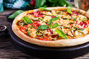 italian-pizza-with-chicken-salami-zucchini-tomatoes-herbs.jpg